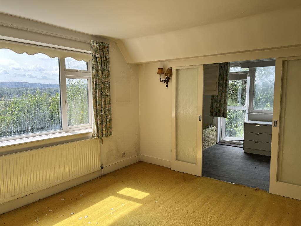 Lot: 2 - DETACHED THREE-BEDROOM HOME FOR IMPROVEMENT WITH COUNTRYSIDE VIEWS - Principal bedroom with en-suite